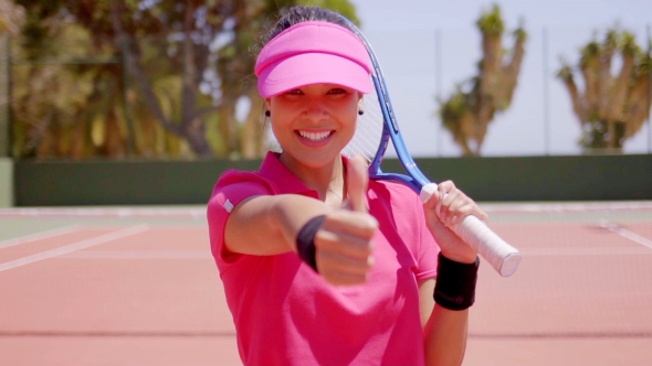 Gorgeous Young Tennis Player Giving a Thumbs Up