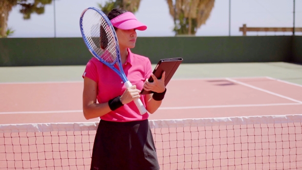 Woman Checking Schedule For Tennis Game