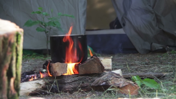 Cooking Food Over a Campfire At The Tourist Pot