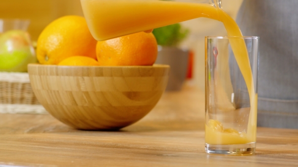 Orange Juice Pouring Into Glass