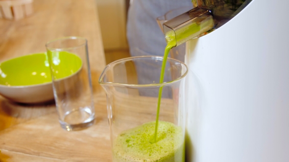 Green Smoothie Woman Making Vegetable Smoothies With Blender.