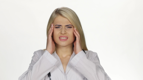 Young Female Doctor Having Headache. White