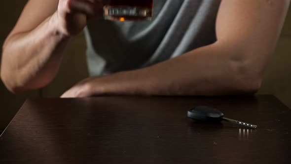 Tipsy Man Drinks Glass of Alcohol and Decides to Drive Car