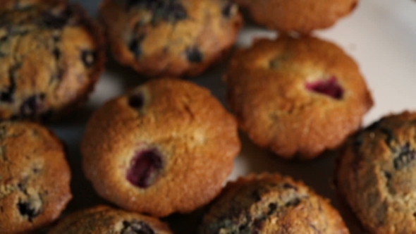 Homemade Wholegrain Muffins With Berries On a White Plate