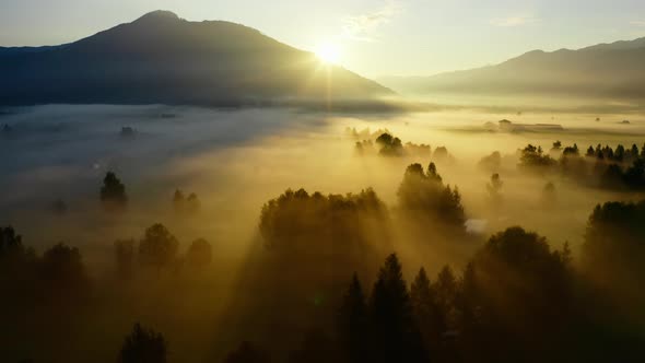 Drone Over Ethereal Misty Landscape Of Zell Am See At Sunrise