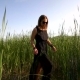 Girl In a Black Dress And Sunglasses Walking In The Field With High Grass - VideoHive Item for Sale
