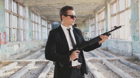 Man In a Suit With a Shotgun