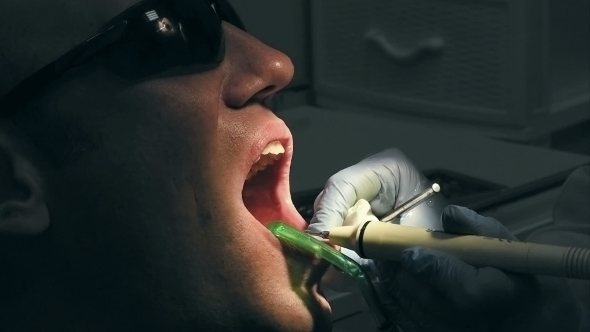 Mid Age Man Gets Medical Teeth Removing Calculus