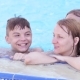 Happy Family Enjoying In Pool - VideoHive Item for Sale
