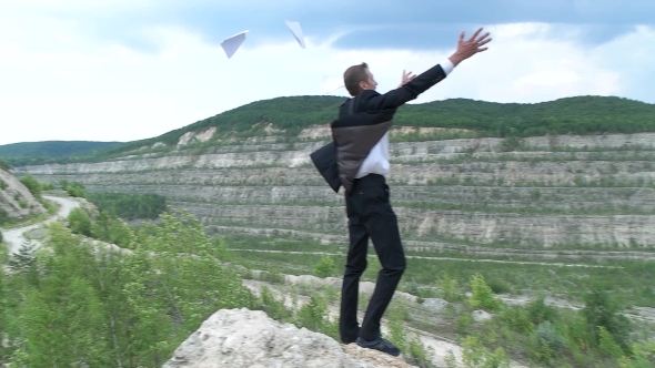 Businessman Throwing Paper On The Hill