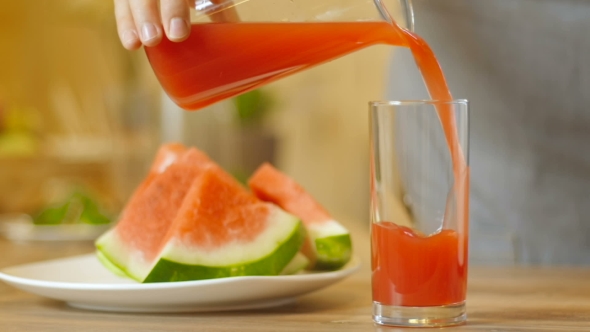 Fresh Red Juice Pouring Glass