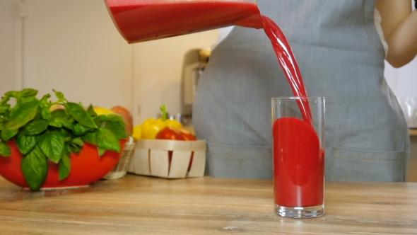 Fresh Red Juice Pouring Glass