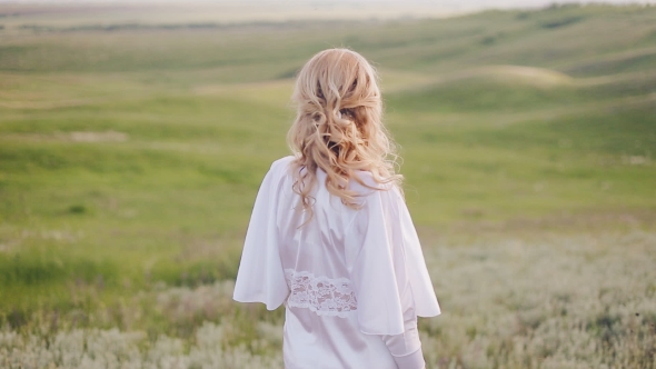 Girl In a Field Turn Round And Looking At The Camera