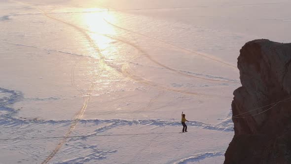 Man is Walking Along a Stretched Sling alt