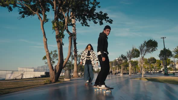 Hipster Couple Skateboarding