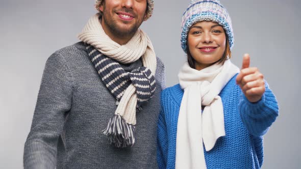 Happy Couple in Winter Clothes Showing Thumbs Up 7