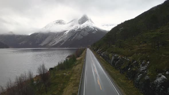 Empty Road  Along Tysfjorden With Stetind, National Mountain In Narvik, Nordland, Norway. - aerial