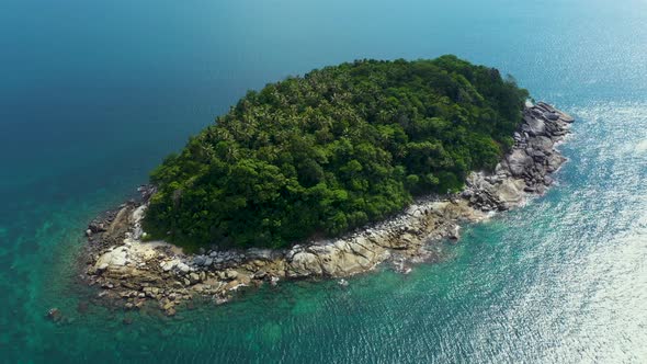 Nice rocks forested island, aerial panorama of Ko Pu against mountainous Phuket landscape on backgro