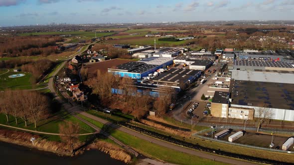 Aerial Drone View Over Industrial Park Beside Oude Maas In Zwijndrecht. Dolly Forward Pan Left