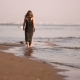 Young Woman Walking On a Coast Line Water Line Legs - VideoHive Item for Sale