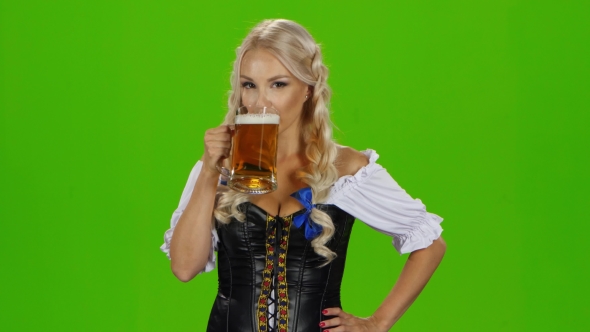 Bavarian Girl Drinking Beer. Green Screen