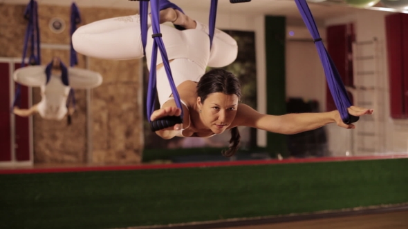 Anti-gravity Yoga, Woman Doing Yoga Exercises Indoor