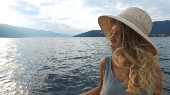 Woman With Hat on Boat Trip