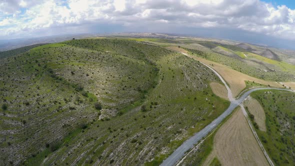 Quadrocopter Flying Above Green Hills, Filming Amazing Landscapes of Cyprus