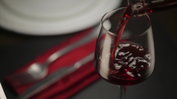 Red Wine Poured Into Glass