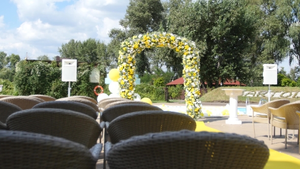 Arch With Fresh Yellow And White Flowers For Wedding Ceremony