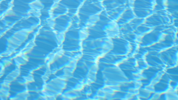 Blue Water In Swimming Pool. Water Motion