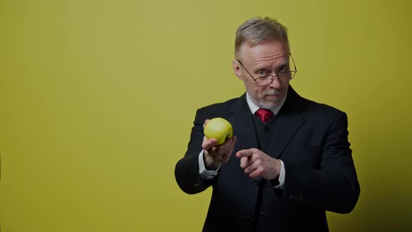 Businessman Pointing on Apple