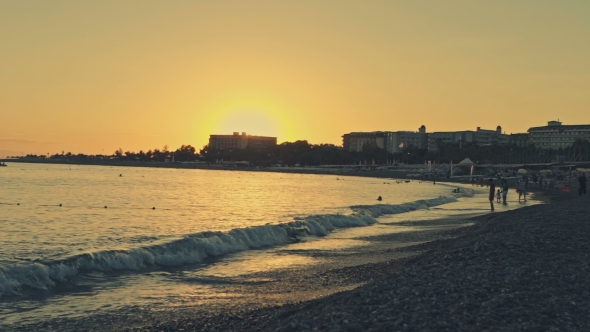 Sunset On The Beach In The Area Tourists