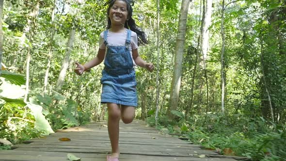Kid Happy Run On Wooden Path
