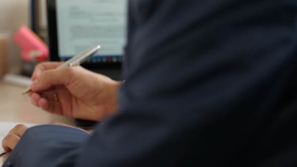 Male Businessman Hands In Suit Sign Paper