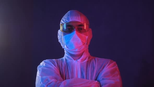 Portrait of a male Researcher in a laboratory in neon blue red light