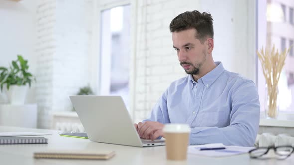 Creative Man Working on Computer at Work