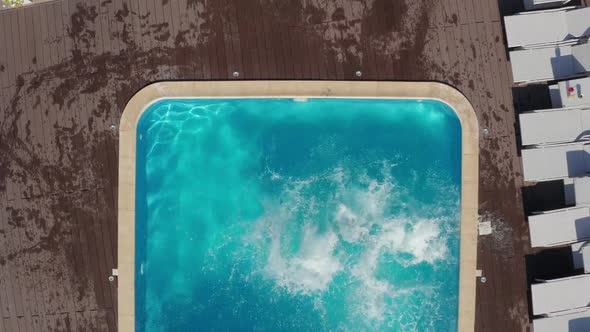 Top View of Diverse Young People Jumping in Pool