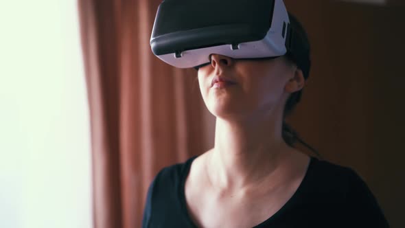 Woman with Vr Headset Walks on Running Machine in Room