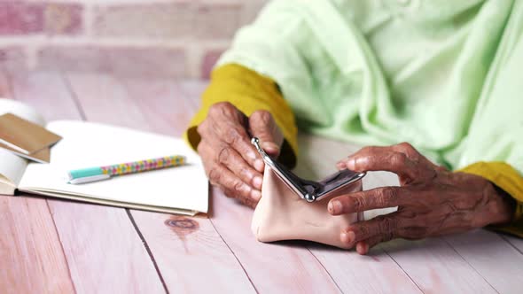 Senior Women Hand Open an Empty Wallet with Copy Space