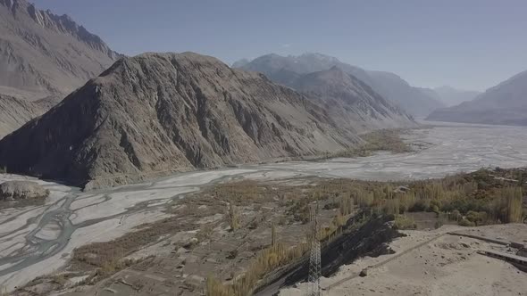 Aerial View Of Skardu Rugged Valley Landscape With River Flowing Through. Dolly Forward