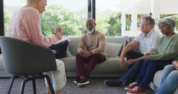 Senior diverse people at meeting talking at retirement home