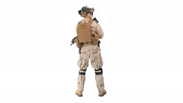 Fully Equipped Solder Holding Assault Rifle and Standing Looking To the Sides on White Background