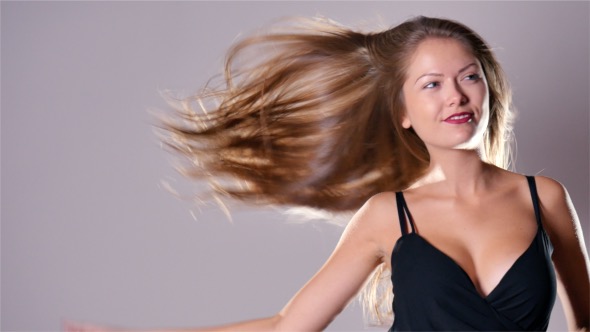 Fashion Woman With Wind in Her Hair