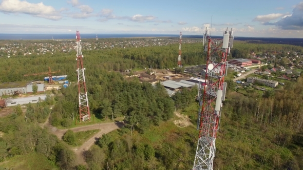 Aerial View Of Antenna Telecommunication Tower among other towers in the forest