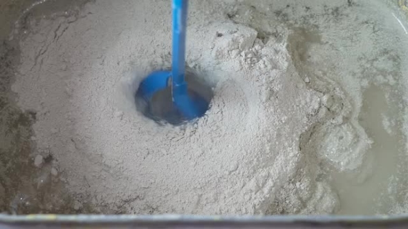 The Process Of Preparing The Construction Of The Putty Dry Mix And Water.