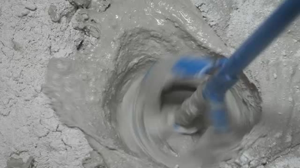 The Process Of Preparing The Construction Of The Putty Dry Mix And Water.