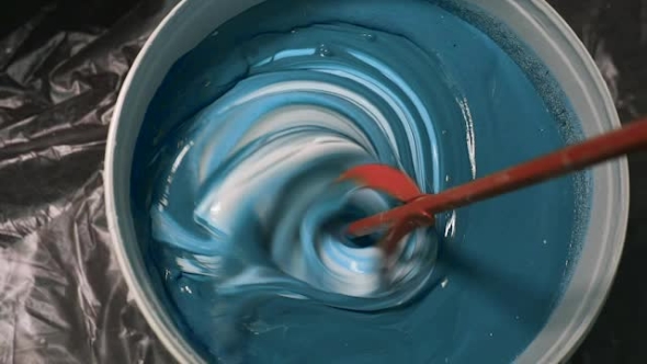The Process Of Mixing White Paint With a Color Tinge In The Bucket Drill With a Special Nozzle alt