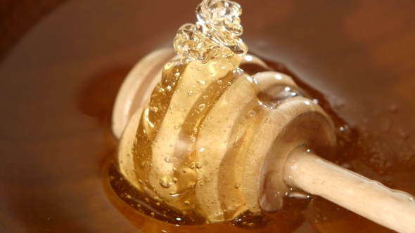 Bowl With Honey And Spoon, Flowing Down