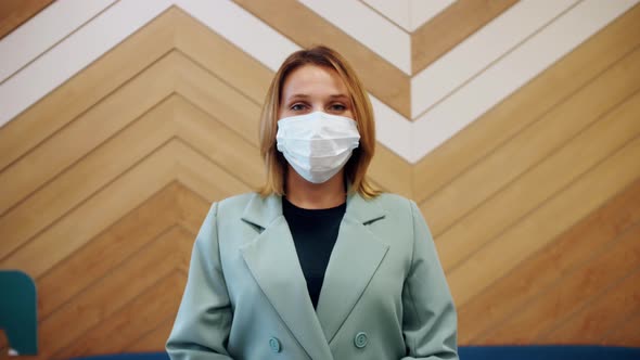 Portrait of Young Hotel Manager in Medical Mask